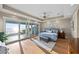 Sunlit bedroom featuring ocean view, hardwood floors, access to balcony, and recessed lights at 2 Gulf Blvd, Indian Rocks Beach, FL 33785