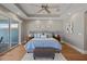 The main bedroom features a tray ceiling and large windows that let in plenty of natural light at 2 Gulf Blvd, Indian Rocks Beach, FL 33785