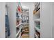Organized walk-in pantry with shelving, drawers, and ample storage space at 2 Gulf Blvd, Indian Rocks Beach, FL 33785