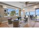Cozy sitting area with stylish armchairs, ocean views, and hardwood floors, perfect for relaxation and conversation at 2 Gulf Blvd, Indian Rocks Beach, FL 33785