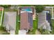 Aerial view of a home with solar panels, screened-in pool, and backyard at 2330 Lawrence Hall St, Ruskin, FL 33570