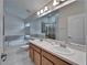 Bathroom featuring double sinks, large mirror, soaking tub and a shower at 2330 Lawrence Hall St, Ruskin, FL 33570