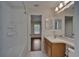 Bright bathroom with a white vanity, toilet, and a shower and tub combination at 2330 Lawrence Hall St, Ruskin, FL 33570