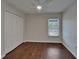 Bright bedroom featuring wood floors, closet and a ceiling fan at 2330 Lawrence Hall St, Ruskin, FL 33570