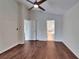 Bedroom with wood floors, a ceiling fan and ensuite bathroom and closet at 2330 Lawrence Hall St, Ruskin, FL 33570
