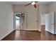 Bedroom with wood floors, sliding glass door to lanai, ceiling fan and a closet at 2330 Lawrence Hall St, Ruskin, FL 33570