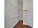 Walk-in closet with a white wire shelving and wood floor at 2330 Lawrence Hall St, Ruskin, FL 33570