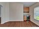 Dining room featuring wood floors and a built-in bar with a wine fridge at 2330 Lawrence Hall St, Ruskin, FL 33570
