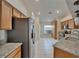 Bright kitchen featuring granite countertops, stainless steel appliances, and tile flooring at 2330 Lawrence Hall St, Ruskin, FL 33570
