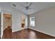 Bright main bedroom featuring wood floors, a ceiling fan and an ensuite bathroom at 2330 Lawrence Hall St, Ruskin, FL 33570
