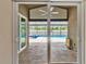 Covered brick patio leading to a beautiful screened-in pool at 2330 Lawrence Hall St, Ruskin, FL 33570