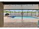 Screened-in pool with sunshade, hot tub, patio and inground pool at 2330 Lawrence Hall St, Ruskin, FL 33570