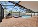 Screened-in pool with sunshade, hot tub, patio and inground pool at 2330 Lawrence Hall St, Ruskin, FL 33570