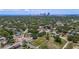 A panoramic view showcasing the home nestled in a green neighborhood, with the city skyline in the distance at 2449 16Th N St, St Petersburg, FL 33704