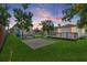A lawn and a patio with a deck at 2449 16Th N St, St Petersburg, FL 33704