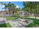 A private backyard featuring a cozy deck, well-maintained lawn, and a serene outdoor living space at 2449 16Th N St, St Petersburg, FL 33704