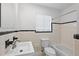 Bathroom features a white tile shower-tub, a toilet, and a single sink vanity at 2449 16Th N St, St Petersburg, FL 33704