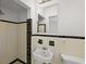 Classic bathroom featuring white tile, a shower, and a pedestal sink at 2449 16Th N St, St Petersburg, FL 33704