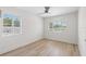 The home features a comfortable bedroom with two windows and a ceiling fan at 2449 16Th N St, St Petersburg, FL 33704