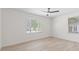 Bright bedroom featuring neutral walls, light floors, recessed lighting and two windows with blinds at 2449 16Th N St, St Petersburg, FL 33704