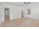 This bright, empty bedroom has many windows and gorgeous floors at 2449 16Th N St, St Petersburg, FL 33704