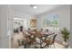This staged dining area is modern and inviting, with a large window at 2449 16Th N St, St Petersburg, FL 33704