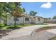 Charming single-story home featuring a well-manicured lawn and walkway, with a classic, welcoming entrance at 2449 16Th N St, St Petersburg, FL 33704