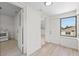 Hallway includes view to a kitchen with a white appliance and an exterior access door at 2449 16Th N St, St Petersburg, FL 33704