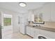 This kitchen has classic white appliances, cabinets, and a stainless steel sink at 2449 16Th N St, St Petersburg, FL 33704