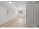Bright room with updated flooring, modern lighting, windows and doors at 2449 16Th N St, St Petersburg, FL 33704