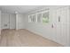 Bright room with updated flooring, modern lighting, windows and doors at 2449 16Th N St, St Petersburg, FL 33704