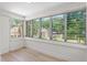 The sun room features natural light, neutral paint, and light wood flooring at 2449 16Th N St, St Petersburg, FL 33704