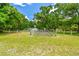 Expansive backyard with lush greenery and secure fencing, perfect for outdoor enjoyment at 25623 Inkwood Pl, Wesley Chapel, FL 33544