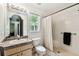Bright bathroom featuring vanity, toilet, and shower with tile surround at 25623 Inkwood Pl, Wesley Chapel, FL 33544