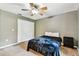 Comfortable bedroom featuring neutral paint, carpet, and ceiling fan with a light fixture at 25623 Inkwood Pl, Wesley Chapel, FL 33544