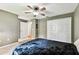 Spacious bedroom featuring double closets, neutral paint, and carpet at 25623 Inkwood Pl, Wesley Chapel, FL 33544