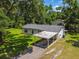 Charming single-story home with a carport and well-maintained grounds at 25623 Inkwood Pl, Wesley Chapel, FL 33544