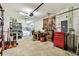 Spacious garage featuring a workbench and laundry machines at 25623 Inkwood Pl, Wesley Chapel, FL 33544