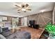 Spacious living room seamlessly connects to the dining area and kitchen, ideal for modern living and entertaining at 25623 Inkwood Pl, Wesley Chapel, FL 33544