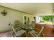 Outdoor patio area with table and chairs, perfect for enjoying the outdoors at 25623 Inkwood Pl, Wesley Chapel, FL 33544