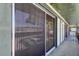 Exterior shot of a screened in sliding glass door on a balcony at 2932 Lichen Ln # D, Clearwater, FL 33760