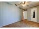 Cozy carpeted bedroom with a ceiling fan, window, and closet at 2932 Lichen Ln # D, Clearwater, FL 33760