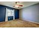 Bright carpeted bedroom featuring a ceiling fan and natural light at 2932 Lichen Ln # D, Clearwater, FL 33760