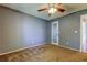 Carpeted bedroom featuring a ceiling fan and a mirrored closet door at 2932 Lichen Ln # D, Clearwater, FL 33760