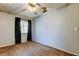 Cozy carpeted bedroom featuring a ceiling fan and natural light at 2932 Lichen Ln # D, Clearwater, FL 33760