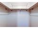 Empty walk-in closet with shelves and rails for easy storage at 2932 Lichen Ln # D, Clearwater, FL 33760