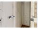 This is a small and dirty closet with a metal door handle at 2932 Lichen Ln # D, Clearwater, FL 33760