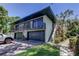 Two-story condo with garages, balconies, landscaped grounds, and exterior stairway at 2932 Lichen Ln # D, Clearwater, FL 33760