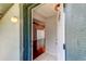 View through the front door into the spacious foyer with hardwood floors and elegant lighting at 2932 Lichen Ln # D, Clearwater, FL 33760