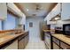 Spacious kitchen features stainless steel appliances, countertops, and view to the living room at 2932 Lichen Ln # D, Clearwater, FL 33760